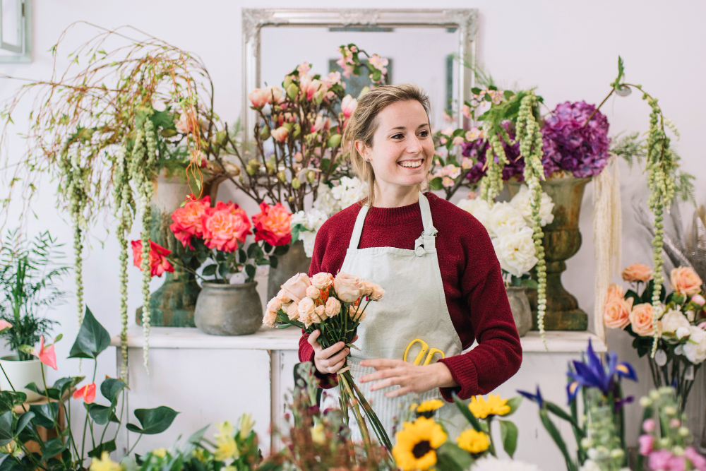 A florist working with flowers in their shop